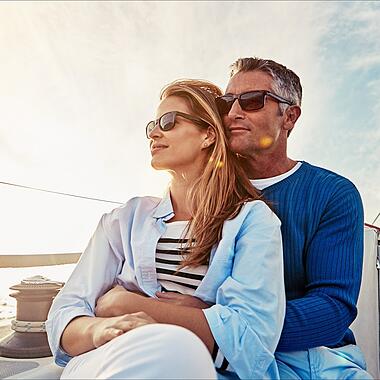 Yacht, travel and love with a mature couple sitting together on a boat out at sea for a romantic date. Luxury, ocean or summer with a married man and woman on a ship to relax during a trip