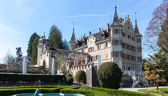 A picturesque view of Seeburg Castle in Kreuzlingen, Switzerland, standing majestically on the tranquil shores of Lake Constance